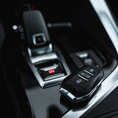 Car alarm installation technician securing vehicle in San Lorenzo, CA