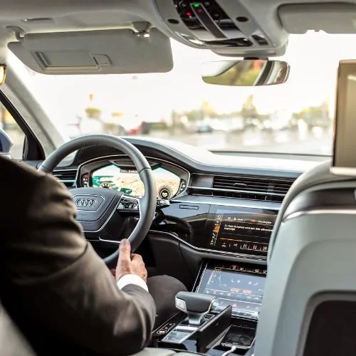 Car stereo install in San Francisco, interior view with driver at dashboard.