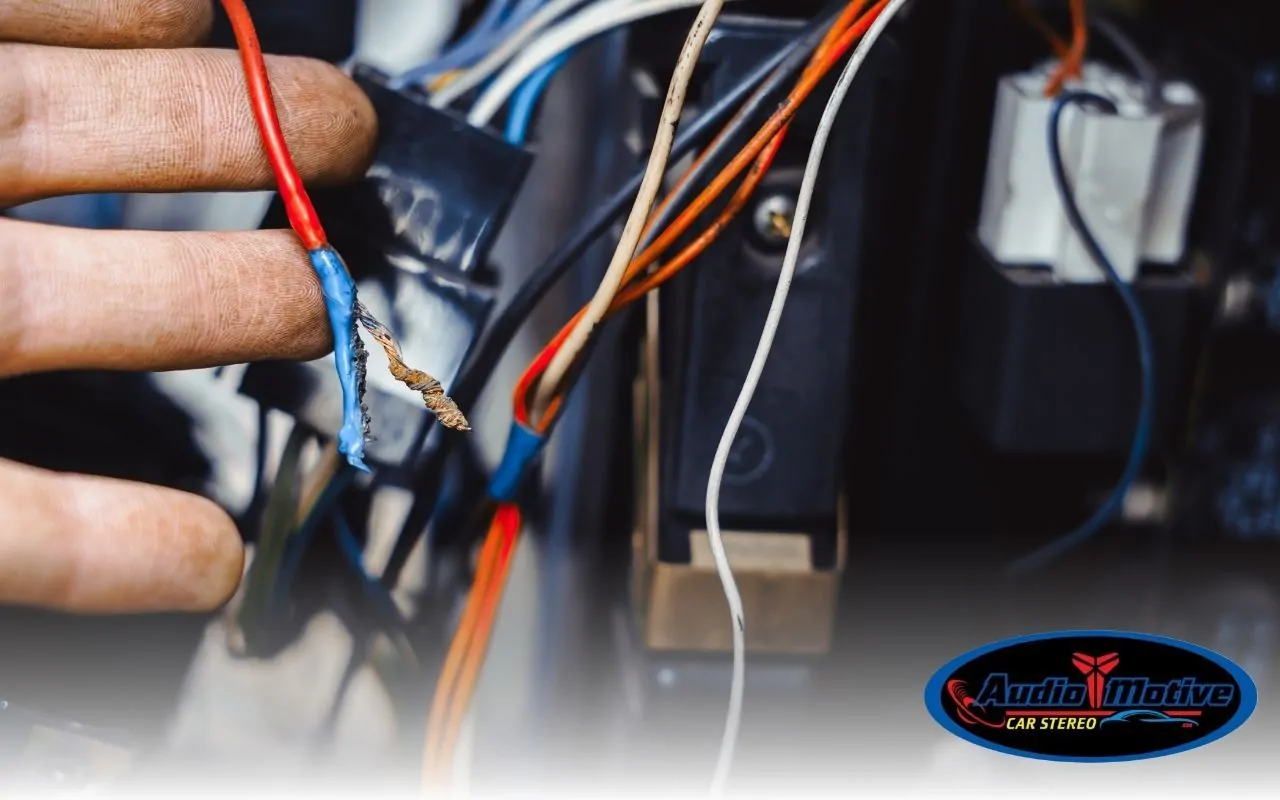 Car dashboard wiring exposed during DIY installation attempt