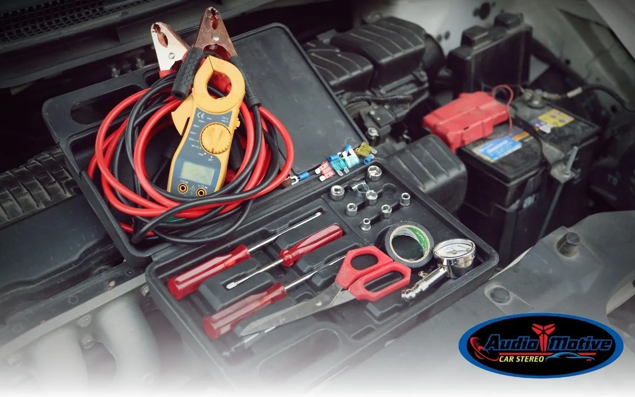 Car audio installation tools and wiring kit on workbench